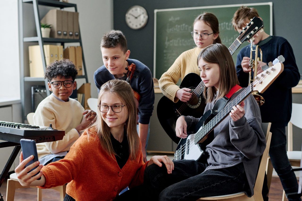 Music Teacher Taking Selfie With Students